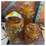 Set of Three Amber Glass Canisters with Lids