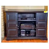 Black Media Console with Audio Equipment