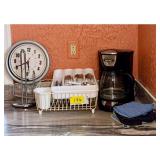 Kitchen Assortment Including Black & Decker Coffee Maker, Sterling & Noble Wall Clock, Cutlery, and Dish Rack