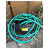 Green Garden Hose in Container