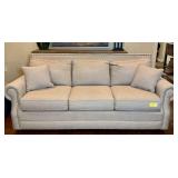 Bassett Furniture Upholstered Sofa with Nailhead Trim and Pillows