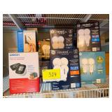 Lot of Home Goods Including LED Light Bulbs, Blood Pressure Monitor, and Bathtub Handle