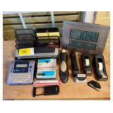 Assorted Office Supplies Lot including Brother P-Touch, Swingline Hole Punch, Tape Dispensers, Staples, and Digital Clock