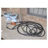 Concrete Statue, (2) Plastic Flower Pots, Water Hose, (2) Bunny Figurines, and Metal Golf Sign