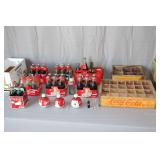 (2) Coca Cola Wooden Bottles Carrier Boxes, Six Pack of 1996 Atlanta Olympics Coca Cola Bottles, Four Pack of Santa Claus Coca Cola Classic Bottles, Six Pack of 125 Years Santa Claus Coca Cola Bottles