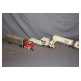 ERTL Mountain Dew Race Team Semi Truck and Trailer, ERTL Southern States Semi Truck and Trailer, and ERTL AMPI Semi Truck with Trailer