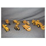ERTL Mighty Movers Caterpillar Road Grader, CAT 988B Articulated Front Loader, International Harvester Dump Truck, ERTL International Harvester 412B Scraper, CAT Challenger 65, and ERTL CAT D25D