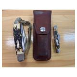 Large and small uncle Henry pocket knife with leather sheath