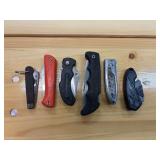 Six small pocket knives