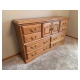 American Heirloom dresser with 8 drawers and a hidden locking drawer 17D x 65L x 40H