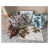 Throw pillows, chair cushions, entry rug, wall art and artificial flowers