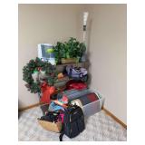 Metal shelf and contents includes gloves, Christmas wreath, comforter, cozy blanket and more