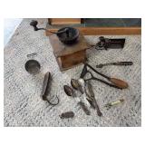 Vintage collectibles includes coffee grinder, double cherry pitter, lid lift, Bullards carpet stretcher , DeKalb bullet pencil and more