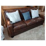 Three cushion sofa with throw pillows 80” long
