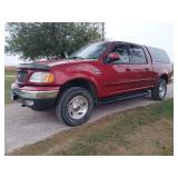 2003 Ford F-150, Crew cab, 4WD, color match Leer topper, 119+ miles, shows no signs of rust but paint is chipped off on lower corners of box, 5.4 L engine. Exhaust manifold bolts are rusted and rattli