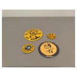 Four Iowa Hawkeyes badges