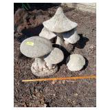 Three cement mushrooms