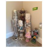 Nutcrackers and cylindrical vase with red and gold balls