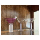 A pair of martini glasses for the happy couple and one for the third wheel