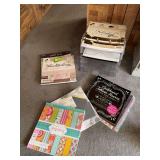 Scrap booking pads of paper and acrylic storage trays