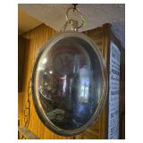 Classic Budweiser 13 x 22 +/- oval rotating clock w/ beer mug and bottle picture opposite side Does light up