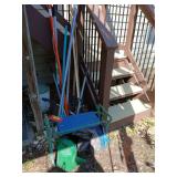 Long handled yard tools, poly tarp, water can, hose brush