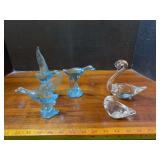 Two lead crystal swans and three ice blue glass ducks