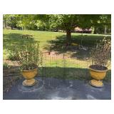 Two 18x29 foam board planters on rollers with flowers and cages to protect them