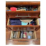 Drawer full of kitchen utensils, linens, etc