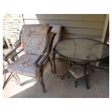 40” round glass topped patio table with 3 stationary chairs and two swivel