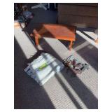 Small bench or stepstool and metal wall decor
