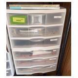 Scrapbooking paper and (2) 3 drawer plastic cabinets