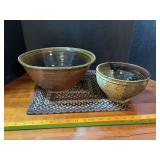 Two pottery bowls and braided placemat, 8” and 12.5”