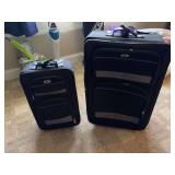Pair of Leisure brand rolling suitcases