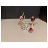 Four glass “eggs” all sizes and colors