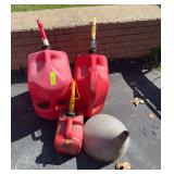 Three gas cans and a funnel