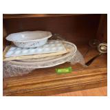 Holiday serving dishes and two ladles