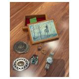 Belt buckles, wristwatch and two rings size 9.5 and 11.5, Larry Zach dresser box, signed