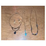Three women’s fetish style necklaces and a pair of quill earrings
