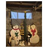 Two wooden cut out snowmen, ceramic snowman, wooden cut out Christmas tree (needs new lights) and Hawkeye Country snow shovel