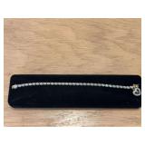 Women’s diamond bracelet with ??? pendant