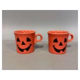Two Fiesta mugs with Jack-O-Lantern faces