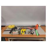 Grease gun, stapler, pry bar, jack, misc