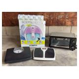 Two bathroom scales, Body Benefits foot spa, bathtub mat and Hamilton Beach toaster oven