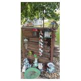 Yard decor includes frogs, wind chimes, shepherd hook, etc