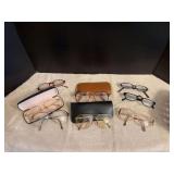 A basket of eyeglasses, men’s and women’s