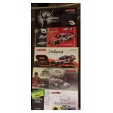 Five 1:24 scale die cast cars as shown