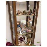 Top 3 shelves of curio includes mini shoes and purses, etc