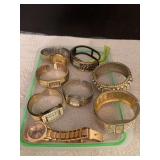 Many blingy watches, bangles