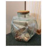 15” tall hexagon glass jar w $$$ inside